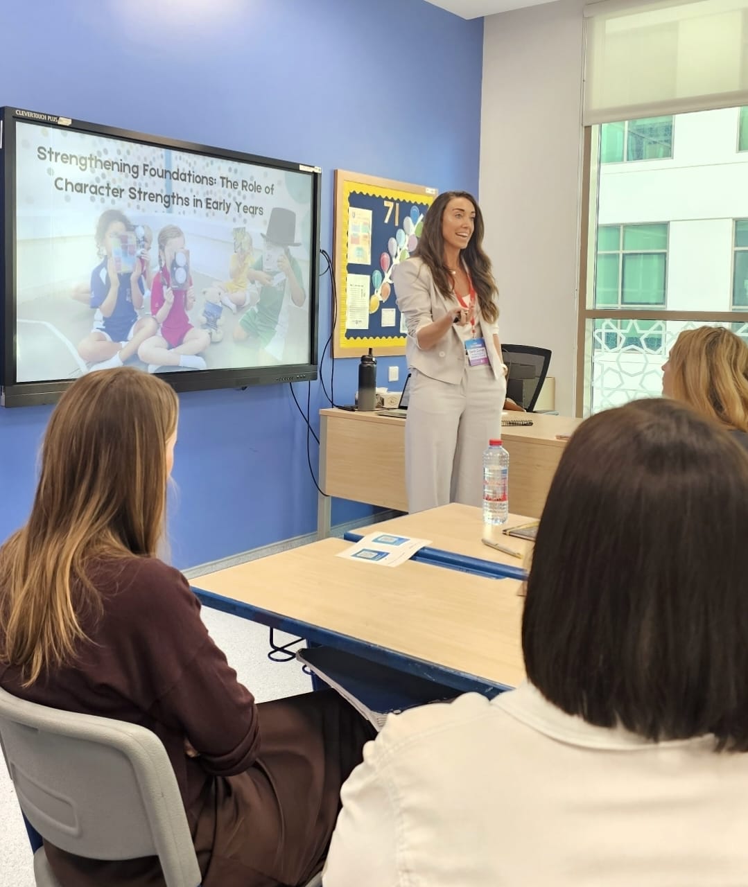 Sarah presenting to an audience of educators